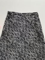 Load image into Gallery viewer, H&amp;M LEAVES PRINTED SKIRT - WAIST 30
